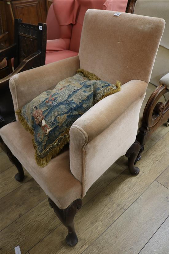 A George II mahogany-framed armchair, covered in gold velvet,